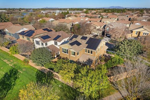 Aerial view of the home near the community lake